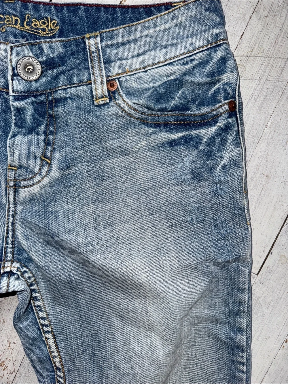 American Eagle Outfitters faded blue distressed jeans